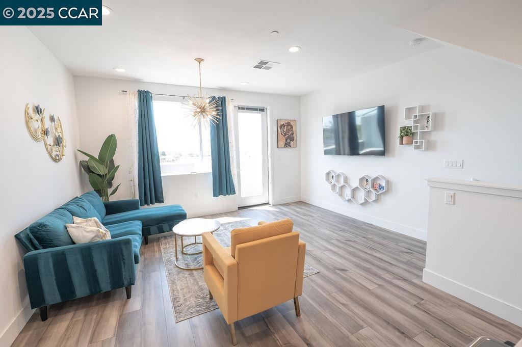 Modern 3 level home with great views, built in 2022 located in the renewed MacArthur Heights neighborhood. Furnished 3 level Townhouse with a beautiful 2nd floor open floor plan with kitchen, living room and 1 bed, 1 bath and balcony with views of the downtown S.F. and Oakland city-scapes. Kitchen features stone counter tops and stainless-steel appliances. 3rd floor has two ensuite bedrooms with separate bathrooms and in unit laundry. 1st floor backyard and garage. Tech includes: Nest thermostats for temperature control & wall mounted TV. Fully owned solar system. Gated HOA community. Located is about 2 minutes to I-580, and about 6 minutes to I-880. A 10 minute drive to Knowland Park, The Oakland Zoo, Lake Chabot, and Anthony Chabot Regional Park, which features 3300 acres, 70 miles of hiking, riding and bicycle trails, and so much more activities for the family. There's so much to love about this home. Apply with RentSpree https://apply.link/r3yq7jk