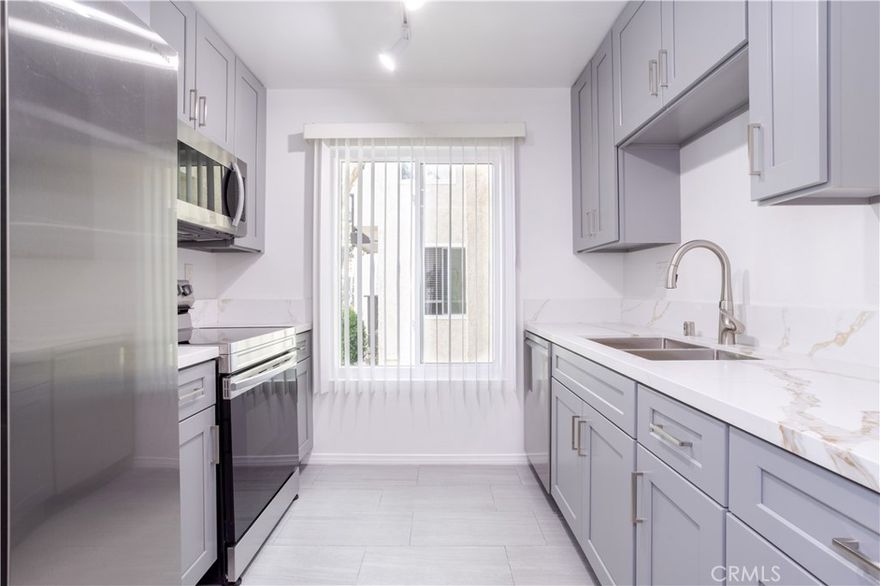Lovely updated 1-bed, 1-bath garden-level condo in the 24-hour guard-gated resort community of Lakeside Village. This light-filled unit features dual-pane windows, a modern kitchen with premium Samsung appliances, an updated bath with a new vanity, central heat & A/C, water-resistant flooring, cozy fireplace, private patio, and one assigned parking space with a convenient storage unit in the garage. 

Enjoy resort-style living with access to 3 pools, 2 hot tubs, a scenic lake with wildlife, and a community center offering billiards, ping pong, fitness gym, sauna, library, and banquet room. Outdoor cabana picnic area with gas grills and ample guest parking. Water, gas, cable, and WiFi included. Centrally located near top-rated Culver City schools, Westfield shopping, dining hotspots, and major freeways.