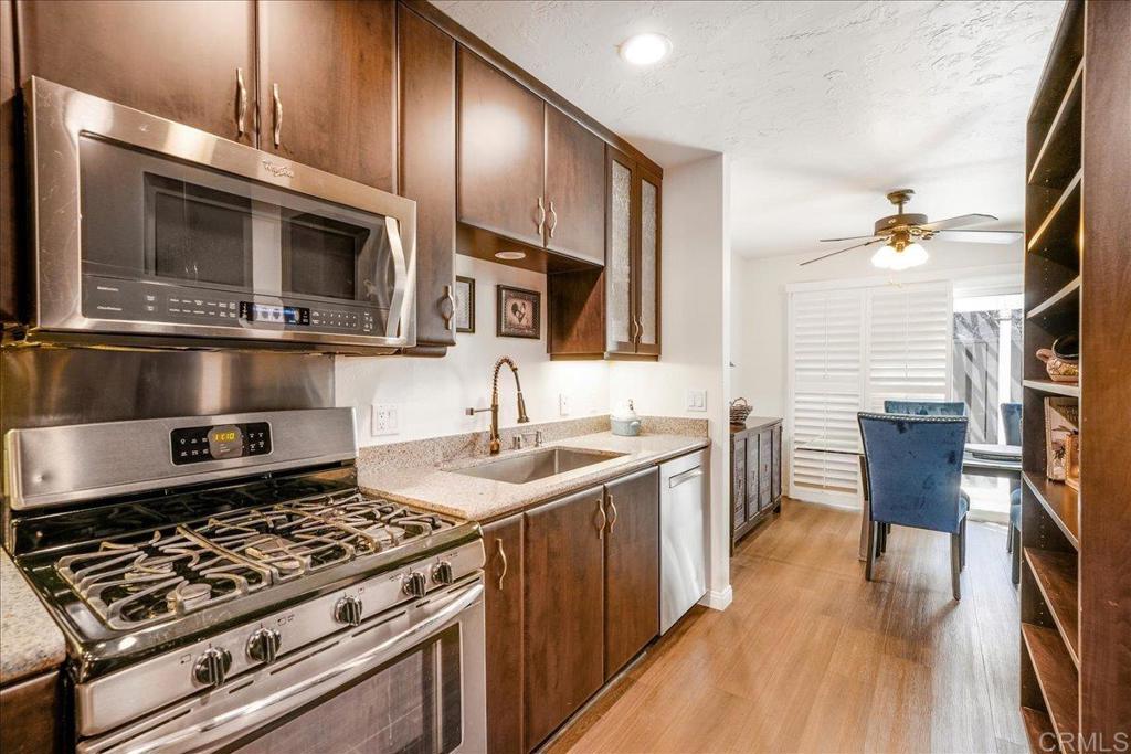 This charming 2-bedroom, 2.5-bathroom townhouse in El Cajon is the kind of place that feels like home the moment you walk in. Each bedroom has its own private bathroom, offering the perfect setup for roommates, guests, or anyone who just loves a little extra space and privacy. You'll love the kitchen—it’s been tastefully remodeled with granite countertops and has the kind of layout that makes cooking and entertaining feel effortless. The home features modern vinyl plank flooring throughout, giving it a clean, updated look, while the window shutters add a touch of classic style. Step outside to a cozy private patio—ideal for sipping your morning coffee, reading a good book, or winding down after a long day. It’s the perfect little outdoor escape. The attached 2-car garage and one assigned parking space give you direct access and makes parking a breeze. The community itself is friendly and well-maintained, featuring a sparkling pool, soothing spa, and convenient RV parking. Whether you're starting out, downsizing, or simply looking for something low-maintenance, this home fits the bill.