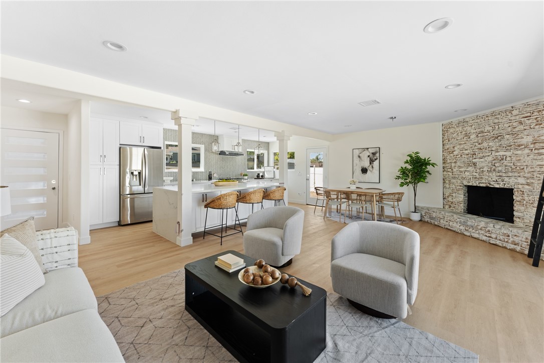 Step inside and be greeted by an open-concept living space designed for comfort, relaxation, and light. To the left, the inviting kitchen island sets the tone- perfect for casual breakfasts or lively evenings with family and friends. With abundant cabinetry, ample quartz counter space, and natural light pouring in through dual pane windows, this kitchen is as functional as it is beautiful.
Just beyond the island sits the dining area, centered around a gas fireplace, and the living room, which opens to the expansive backyard through a sliding glass door. Step outside and you’ll find yourself on over half an acre of land- your blank canvas to create the ultimate equestrian or entertainer’s paradise. Whether it's a riding arena, barn, or lush garden retreat, this space is ready to bring your vision to life. And in the evening, relax with the stunning views of the city lights along the horizon.
Back inside, a beautifully renovated guest bathroom sits conveniently near the common areas. The spacious primary bedroom offers a serene escape with a bathroom featuring dual sinks and a sleek, tiled shower- the perfect spot to unwind after a sunset ride through the neighborhood. Two additional bedrooms provide comfort and flexibility, with one offering breathtaking views of the backyard and city skyline.
This is more than just a house- it’s a lifestyle. An opportunity to own a move-in ready home in a neighborhood where horses are part of the lifestyle.