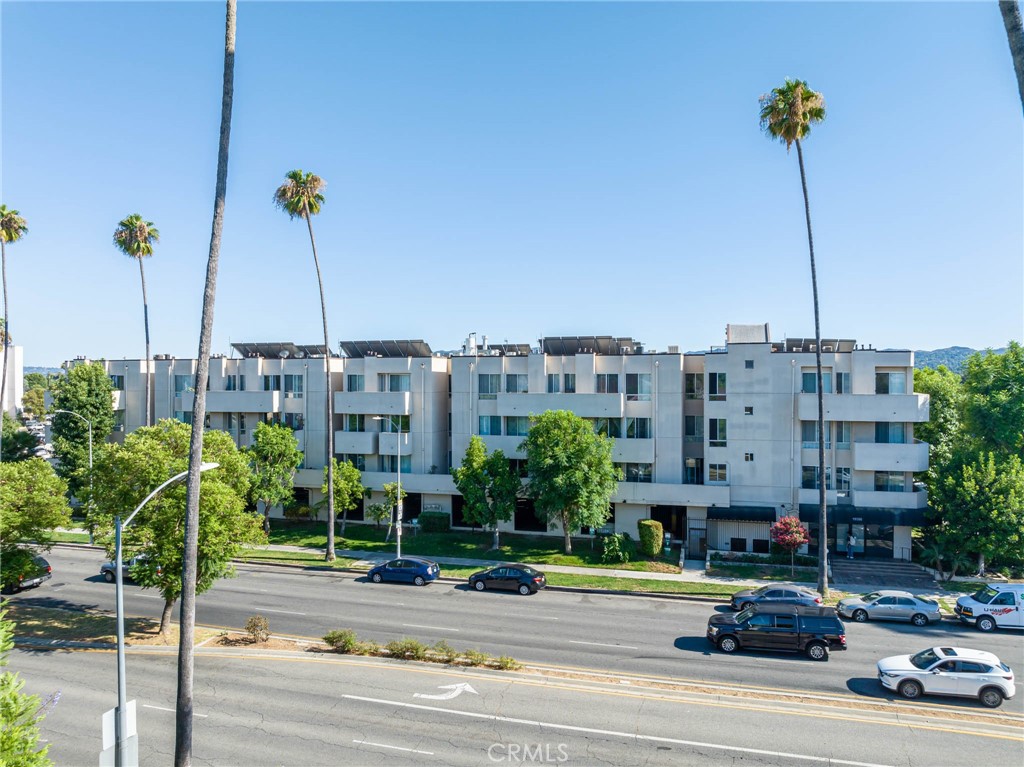 Welcome to this beautifully updated 2-bedroom, 2-bathroom condo in an FHA-approved gated community. Ideally situated in a prime location within the complex, this home offers easy access from the parking garage to the elevator and directly to the unit. The inviting living area features a cozy fireplace and opens to a private balcony. The kitchen and both bathrooms have been tastefully upgraded with granite countertops creating a cohesive feel through the home. The primary bedroom boasts a spacious closet, linen storage, and a private full bathroom. The second bedroom also offers balcony access, providing indoor-outdoor flow. There is a 2nd full bathroom off the hall. Additional highlights include in-unit LAUNDRY, central A/C, no downstairs neighbors and 2 (tandem) parking spots plus private gated storage area. Residents enjoy a full suite of amenities including a pool, spa, sauna, recreation room, gym, EV charging stations, and guest parking. The community is centrally located near public transportation, shopping, dining, and more, making it a convenient place to call home.