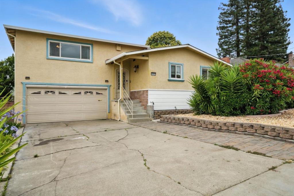 Welcome to your dream home! This stunning split-level house offers 3 bedrooms, 2.5 bathrooms, and 2,400 square feet of living space. Nestled in a desirable cul-de-sac in the Hayward Hills, just minutes from Castro Valley, this prime location provides easy access to shopping, dining, entertainment, and picturesque hiking trails.Step inside and discover a beautiful kitchen designed for both everyday living and entertaining. It includes stainless steel appliances, granite countertops, and a large island perfect for meal preparation and social gatherings. You'll appreciate the ample pantry space and the convenience of pull-out shelves in the kitchen cabinets, maximizing storage and organization. The main living room is bright and airy, with expansive windows that allow for plenty of natural light. On the lower level you'll find a second expansive living space, ideal for a family room, entertainment area, or den, featuring a convenient wet bar with a sink and cabinets.The partially finished basement provides abundant storage, laundry room w/utility sink, & wine rack. A spacious 2-car garage, low-maintenance landscaping, & AC ensure year-round comfort. The backyard features a gazebo with included patio furniture. Adding to its appeal, the roof is approximately 6 yrs old. Offer today!