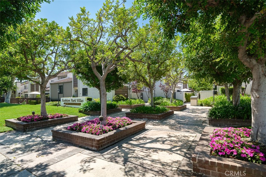 Beautiful end unit townhome situated in one of the most sought-after communties in Arcadia. Fantastic neighborhood and location. Short proximity to West field plaza, shopping, grocery stores, bakeries, parks, great schools and the best restaurants, all just minutes away. This unit in the Fashion Park Villa Complex is conveniently located in back of the complex in a very serene and quiet setting away from the street. Only attached on one wall it has a wonderful open floor plan with high ceilings and a great view of the pool area. Features include; 2 large bedrooms and a loft, formal entry, main living/dining area with fireplace that open to the enclosed private patio for entertaining. On main level there is the living areas, a spacious remodeled kitchen with ample cabinetary, quaint eating area, bedroom and a remodeled bathroom with new tile work, fixtures and glass shower enclosure. On the second level, there is the loft area and a large primary suite with a spacious walk-in closet with built-ins and a primary bathroom with double sinks and tub shower. Attached direct access double garage with storage. Gorgeous park-like association grounds with heated pool and spa and various lounging areas. Association dues pays for insurance, water usage inside of unit, trash and exterior maintenance.