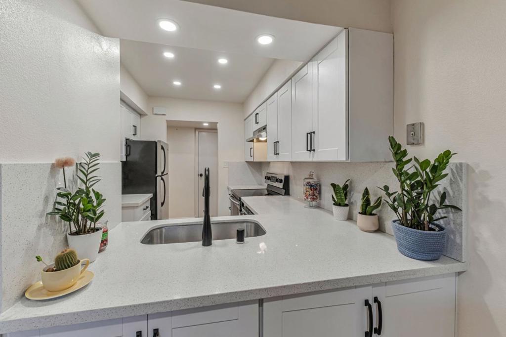 Welcome to your new home in the Villas of Capitola! This beautifully updated, ground-floor condo offers 2 spacious bedrooms and 2 modern bathrooms, all on a single-level layout designed for comfort and convenience. Step inside to a light-filled living room featuring a cozy fireplace - perfect for those cool coastal evenings. The home has been thoughtfully renovated throughout and is truly move-in ready. Enjoy seamless indoor-outdoor living with a large private patio complete with a deck - ideal for relaxing, entertaining or gardening. Located in a quiet community with a sparkling central pool, this home offers easy access to everything. Walk to Capitola Village, local shops, restaurants and everyday amenities. Easy access to the freeway for a quick commute. Additional highlights include one dedicated carport with storage, conveniently located right outside your gate. The area also offers plenty of guest parking. Dont miss this opportunity to own a turnkey home in one of Capitolas most desirable neighborhoods. Seller will pay up to one year HOA dues with an accepted offer!