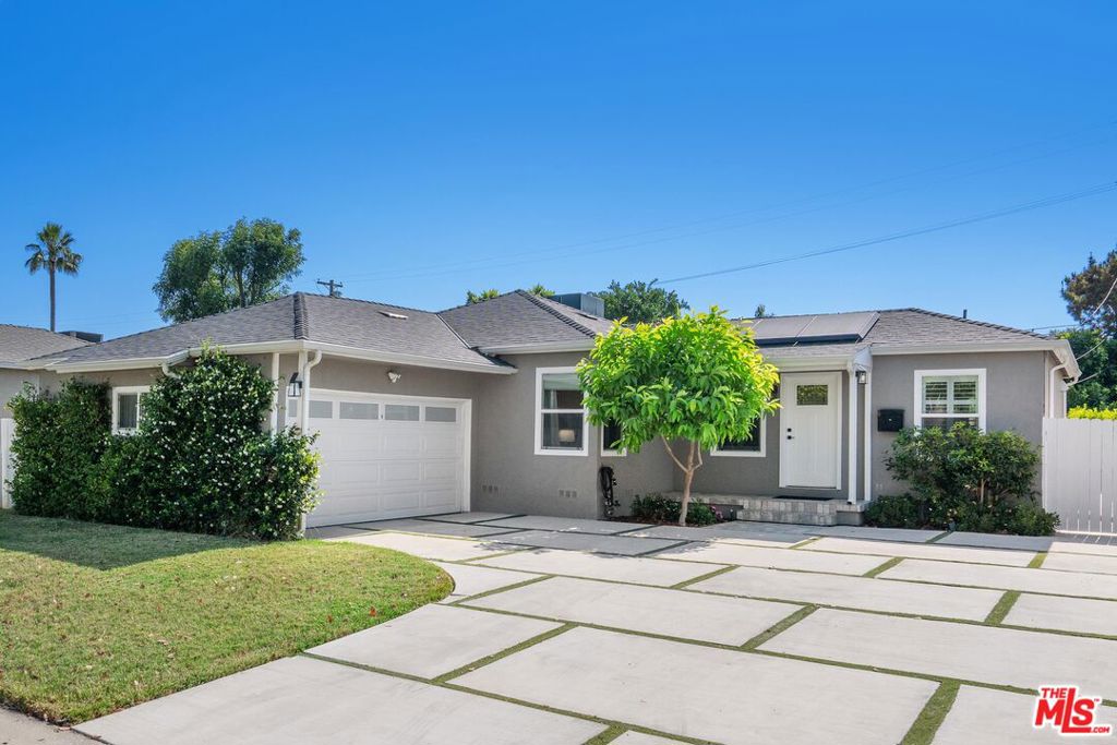 This stunning 4BD/2BA home has been thoughtfully remodeled with high-end finishes and modern conveniences. Step into a spacious living room filled with natural light. The open-concept chef's kitchen has soft-close white shaker cabinetry, quartz countertops, a Carrera marble backsplash and newer appliances. The generous family room and dining area seamlessly connect to the lush backyard, offering an ideal setup for indoor-outdoor living. The primary suite includes dual closets and a luxurious en-suite bathroom complete with a dual Carrera marble vanity and a Carrera marble tile shower. Two additional spacious bedrooms share a beautifully updated full bathroom with a modern vanity, tiled shower and tub combo. The fourth bedroom, with sliding doors, makes an excellent home office, playroom, or guest room. Additional highlights include a convenient inside laundry area and a fully paid, value-enhancing, and money-saving solar energy system. The expansive private backyard is perfect for entertaining, complete with a new AlumaWood patio cover and pergola, mature fruit and citrus trees and a sizable grassy lawn. Located near top dining, shopping and parks, welcome!