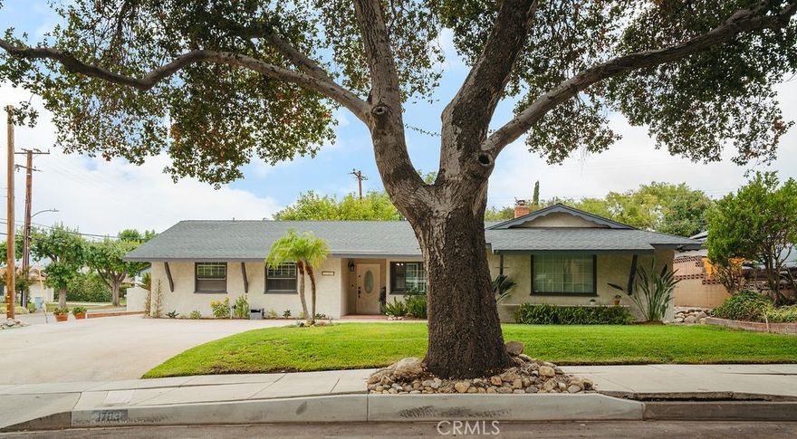 This beautiful home, updated and perfectly situated, offers everything you need in a prime Upland location.

Located on a charming **tree-lined street** and just a block from **Pepper Tree Elementary**, this inviting **four-bedroom, three-bathroom** home boasts one of Upland's best spots. As a **corner lot**, it provides both curb appeal and an extra sense of space. The property is in **excellent condition** and features numerous modern upgrades, including updated flooring, refreshed bathrooms, and newer fixtures throughout.

Step inside to a modern, **open floorplan** that immediately feels welcoming. The main living space features a cozy **fireplace** in the living room, a dedicated dining area, and a bright kitchen with delightful **views of the backyard**.

The home's thoughtful layout provides both unity and privacy. On one side, you'll find the main sleeping quarters: a spacious **Primary Suite** with its own private **en-suite bathroom**, plus two additional bedrooms that share a second full bathroom.

The real bonus is the highly flexible space on the opposite side of the home. Here you'll find the **family room with fireplace**, the **fourth bedroom**, and the **third bathroom**. This setup creates a fantastic, semi-private **guest suite**perfect for an in-law quarters, long-term guests, or a teenager's retreat. Alternatively, this quiet wing would make an ideal **private home office** or a dedicated **study/play area** 

The large backyard is a true outdoor haven. It features a generous amount of **patio and garden** for play and entertaining, established **fruit trees** including 2 orange, tangerine, apple, lemon, and grapefruit, and a handy storage **shed**. 

The fantastic location, updated condition, and flexible floor plan make this a must-see home!