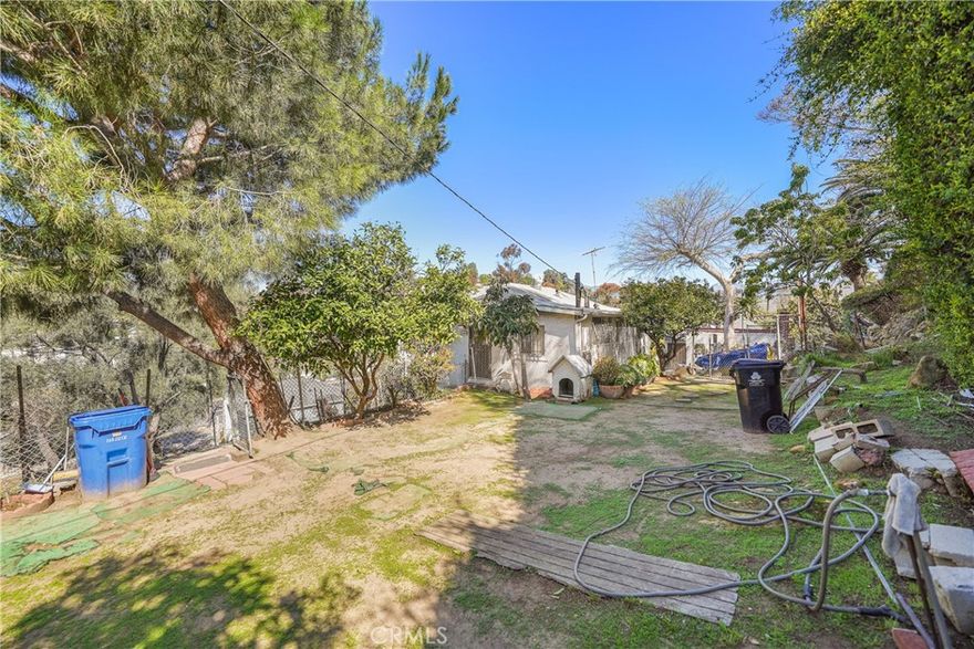 Nestled in the heart of Echo Park, this 2-bedroom, 1-bath fixer-upper presents an incredible opportunity to renovate, expand, or build new in a prime Los Angeles location. The main house (1,086 SF per assessor) sits on a generous 50x150 ft lot and features a raised foundation, a lower-level recreation room, and an additional workshop space with plumbing access. A separate 396 SF playroom (built in 1938) adds versatility, ideal for an office, studio, or guest retreat. This property also includes a second parcel (APN: 5422-021-005) designated for an irrevocable easement and right of way, enhancing accessibility. Additionally, a leveled parking pad provides extra parking space, a valuable feature in this high-demand neighborhood. Whether you're an investor, developer, or buyer with a vision, the possibilities are endless—remodel, expand, or create a brand-new masterpiece. Located just minutes from Elysian Park, vibrant cafes, and DTLA, this is a rare find in one of LA’s most desirable neighborhoods. Don’t miss this incredible opportunity!