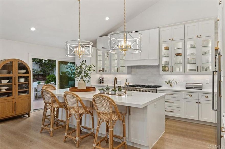 Experience resort-style living in Lake San Marcos. Located in the coveted Colony community, this 3 bed, 2 bath single-level COMPLETE REBUILD blends sophisticated design with relaxed California living. A MUST SEE!  The BRAND NEW chef-inspired kitchen showcases sleek quartz countertops, custom cabinetry and premium appliances—designed for both style and function. Luxury vinyl plank flooring flows seamlessly through the open-concept living spaces, highlighted by a cozy fireplace and designer finishes throughout. The primary suite is a true sanctuary complete with a walk-in closet and a spa-inspired bathroom.  Step outside to your private backyard oasis—this EXTRA LARGE space is the ultimate entertainer’s paradise. Enjoy the custom putting green, unwind by the firepit , or host friends for alfresco dining under the stars.  Nestled in an active lakeside lifestyle community, residents enjoy access to golf, tennis, pickleball, boating, scenic walking paths, and vibrant social events—just minutes from top dining, shopping, and beaches.  This home features all new electrical panel, plumbing, HVAC system, Coughlin windows, HALO water purification system.