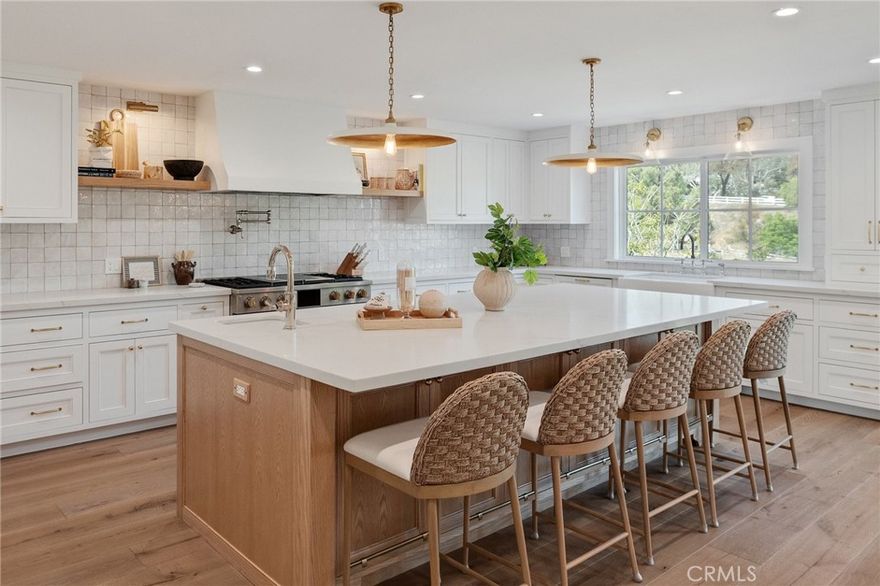 Welcome to this exquisitely remodeled ranch home located in the prestigious community of Rolling Hills Estates. Nestled at the end of a peaceful cul-de-sac surrounded by mature trees and scenic views, this turnkey residence effortlessly combines timeless charm with modern luxury.

Completely updated from top to bottom, this 4-bedroom, 4-bathroom home features a bright, thoughtful floor plan with designer finishes throughout. The chef’s kitchen boasts custom cabinetry, marble countertops, a large center island, and MONOGRAM luxuxry appliance package — perfect for everyday living and entertaining. The living and dining areas are enhanced by wide-plank engineered hardwood flooring, recessed lighting, and expansive windows that invite natural light and highlight the home's serene setting. The spacious primary suite offers a spa-like ensuite bathroom with a walk-in shower, soaking tub, dual vanities, and a generous walk-in closet. The secondary bedrooms are equally well-appointed and offer ample space and comfort. Downstairs, you'll find a spacious family/game room complete with a custom wet bar & fireplace—ideal for game nights, movie nights, or relaxing with family and friends. This lower-level retreat also offers convenient access to the laundry area, a 3/4 bathroom and additional storage. Meticulously upgraded, and artistically crafted finishes are found at every turn. 

Enjoy California living at its finest with a expansive backyard retreat featuring several fruit trees and open space to entertain. This private sanctuary offers a rare opportunity to own over 30,000 sqaure foot large lot, country living with the patio for outdoor dining, and plenty of room for horses and a gate to the adjacent horse trail. Located in a family friendly and private neighborhood, close to Rancho Vista Elementary School, this is a home to treasure moments and watch the kids to grow up in a beautiful setting exploring trails with their pets.

A three car garage and RV parking on the side are added bonus to this value packed home.

Located near award-winning schools, equestrian trails, parks, restaurants, shopping, hospital, and golf courses, this move-in-ready gem offers the best of Rolling Hills Estates living. A rare opportunity—don’t miss it!