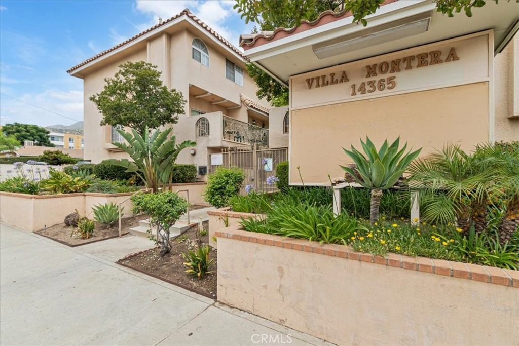Beautifully updated 3-bedroom, 2.5-bath townhome in a well-maintained Sylmar community. This spacious home features a bright living room with a cozy fireplace and plantation shutters throughout. The kitchen offers ample cabinet space, a breakfast area, and a separate formal dining area. Upstairs includes a primary suite with private bath, two additional bedrooms, and a full hallway bathroom. Enjoy a large private patio—perfect for outdoor dining or entertaining—and an attached 2-car garage with laundry hook-ups. Conveniently located near shopping, dining, and easy freeway access. Move-in ready and full of charm!