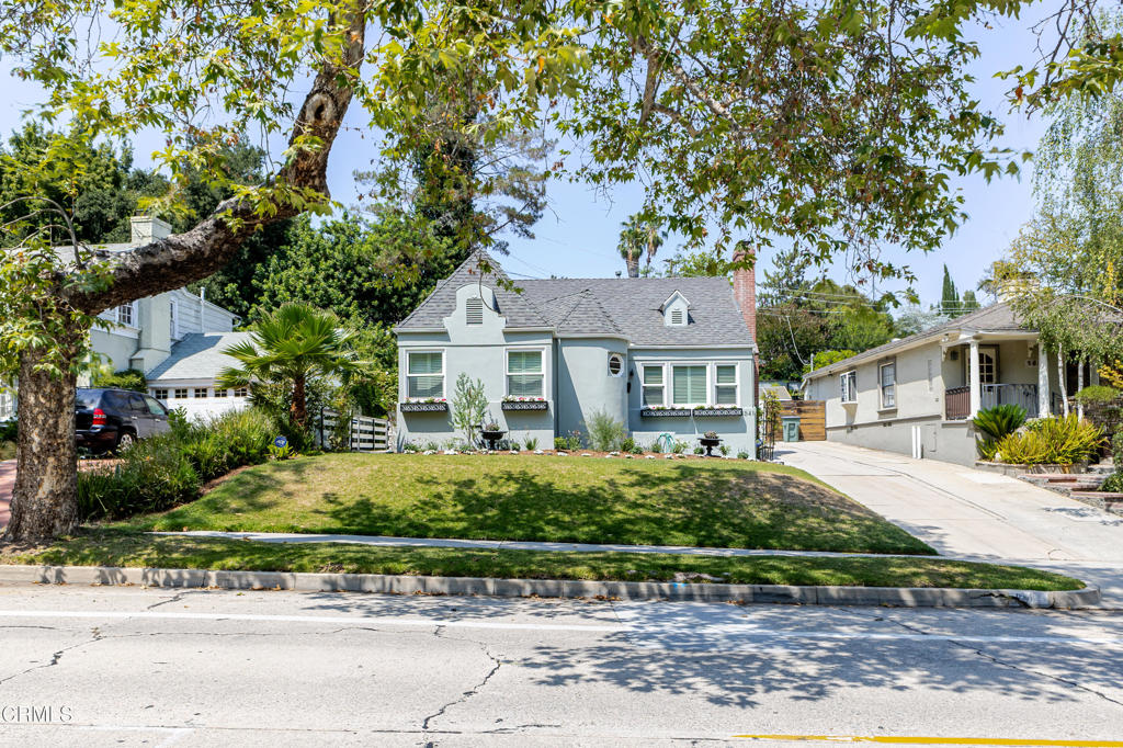 Fully Remodeled Turnkey Gem! Step into timeless elegance with this meticulously remodeled 1939 English cottage, brimming with character and ideally situated in the desirable San Rafael Hills neighborhood. This 2-bedroom, 2-bath home with a versatile den has been thoughtfully updated while preserving its vintage charm.From the beautifully refinished oak floors to the newly updated gas fireplace with custom mantel, every detail has been carefully considered. The remodeled kitchen is a showstopper, featuring Carrara marble countertops, a farmhouse sink, custom tile flooring, and newer appliances--including a built-in wine refrigerator, washer/dryer, and dishwasher.The home has been fully upgraded for modern comfort: updated main line, updated electrical panel, recessed lighting, central A/C and heat, tankless water heater, plantation shutters, and energy-efficient dual-pane windows with double insulation.Both bathrooms are finished in timeless Carrara marble with classic styling and clean lines. The finished garage is a standout feature, offering polished concrete floors, insulated walls, exposed beam ceilings, and its own electric A/C--perfect as a workspace, studio, or home gym. Enjoy outdoor living with a custom pergola and shade cover, flagstone patio, terraced lawn, and fully fenced yard with automatic sprinklers--ideal for entertaining or relaxing in total privacy. All just minutes from Old Town Pasadena, and the vibrant communities of Highland Park and Eagle Rock. This is California living at its best--turnkey, tasteful, and truly one of a kind.