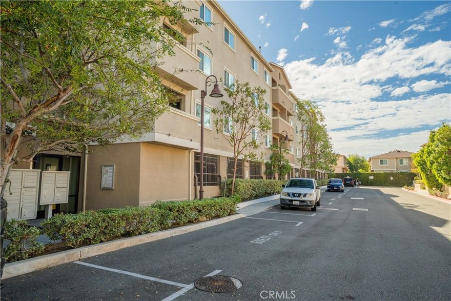 Welcome to this bright and spacious 3-bedroom, 2-bathroom condo in a very well-maintained 2010-built, gated condo community—the perfect blend of comfort, style, and convenience. This top-story unit enjoys abundant natural light throughout. The home features an open-concept living and dining area, perfect for entertaining or relaxing at home. The updated kitchen includes sleek countertops, newer appliances, and ample cabinet space. Each bedroom is generously sized, with large closets providing plenty of storage.  The home is truly move-in ready and even includes an in-unit washer and dryer, central AC and heating, and a new water heater (2024). Enjoy peace of mind in this secure building offering two tandem parking spaces, plenty of guest parking, and access to a BBQ area and a recreation room for gatherings or events. The community is pet-friendly and well-kept, offering a low-maintenance lifestyle. Located adjacent to a beautiful local park with frequent community events, this condo offers the perfect balance of neighborhood charm and city convenience. You’ll love the proximity to shopping, restaurants, and quick freeway access to the 110. Your turnkey condo is ready for you.