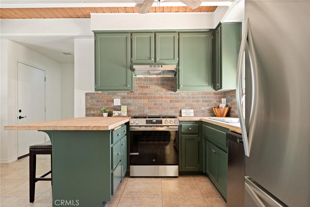 This is the CUTEST CABIN EVER!!!! YOU WILL LOVE the Just Remodeled Kitchen with Forest Green Cabinetry, Brick Backsplash and Butcher Block Countertops! Breakfast Bar and Separate Dining Are too! So Cute!!! Stylish Living Room and Dining with Beamed Ceilings and Cozy Corner Fireplace! Upstairs are 2 Bedrooms with Oversized Closets and a Full Bath! Laundry Hookups in Hallway Closet for Convenience! Some Newer Windows, Brand New Heaters and all New Luxury Vinyl Planking on the Stairs, Bedrooms and Bath Upstairs! Bathrooms Got a Redo too with New Vanities, Faucets, Toilets, Lighting, & Mirrors! Nice Long EASY Driveway Can Hold 3+ Cars... the Adorable Covered Porch to Sit Outside on & Enjoy the Fresh Mountain Air is AMAZING!!! There is a Fenced BackYard too with Awesome Covered Shed for Storage! 5 Minute Drive to Blue Jay and 10 To Lake Arrowhead or Crestline!