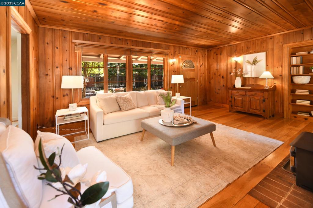 Open House 8/26 10-1pm. Charming 1940s Home on Expansive .58 Acre Lot in S. Walnut Creek. This beautifully updated & expanded 1940s gem sits on over 1/2 acre in one of Walnut Creek’s most sought-after neighborhoods. A welcoming courtyard entry leads to a home filled with character & thoughtful upgrades. Inside, you’ll find rich hardwood floors, wood-paneled walls and ceilings, and fireplaces in both the living room and sunroom—perfect for cozy evenings or enjoying breakfast while watching the wildlife outside. The light & bright dining room also features a china closet, adding to the home’s vintage charm. Updated kitchen boasts Corian counters, stone backsplash, pantry, rolling shelves, butler’s pantry, & 5-burner gas range, making it ideal for both everyday cooking & entertaining. Spacious laundry room could be converted into a kitchenette for multigenerational living. Bedrooms feature large closets & a skylight brightens the hall bathroom w/ natural light. Step outside to a deck & expansive backyard w/ endless possibilities—add a garden, build additional structures, or simply enjoy the peaceful setting. The large lot also offers ample parking for multiple vehicles. Just minutes from top-rated schools, downtown, Lar Rieu Park, BART & fwy access. Come explore the possibilities!