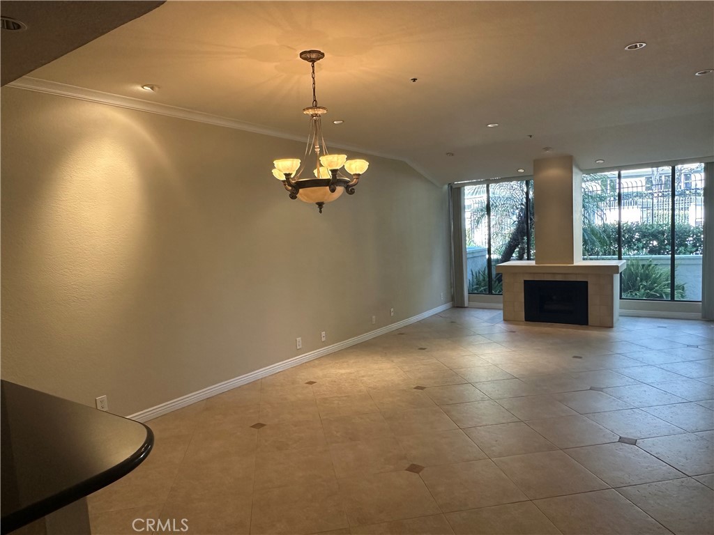 Discover coastal living at its finest in this upgraded 1-bedroom, 1-bath condo in the highly desirable community of Villa Balboa, Newport Beach. This open-concept home features an inviting living room with a cozy fireplace, an upgraded kitchen with a spacious dining area that flows seamlessly for entertaining. Highlights include in-unit laundry and a large private patio ideal for relaxing or dining al fresco. The generously sized bedroom and updated bathroom provide comfort and style, while community amenities include pools, spas, pickle ball, tennis courts, a fitness center, and scenic walking paths—all just minutes from the beach, shopping, and dining