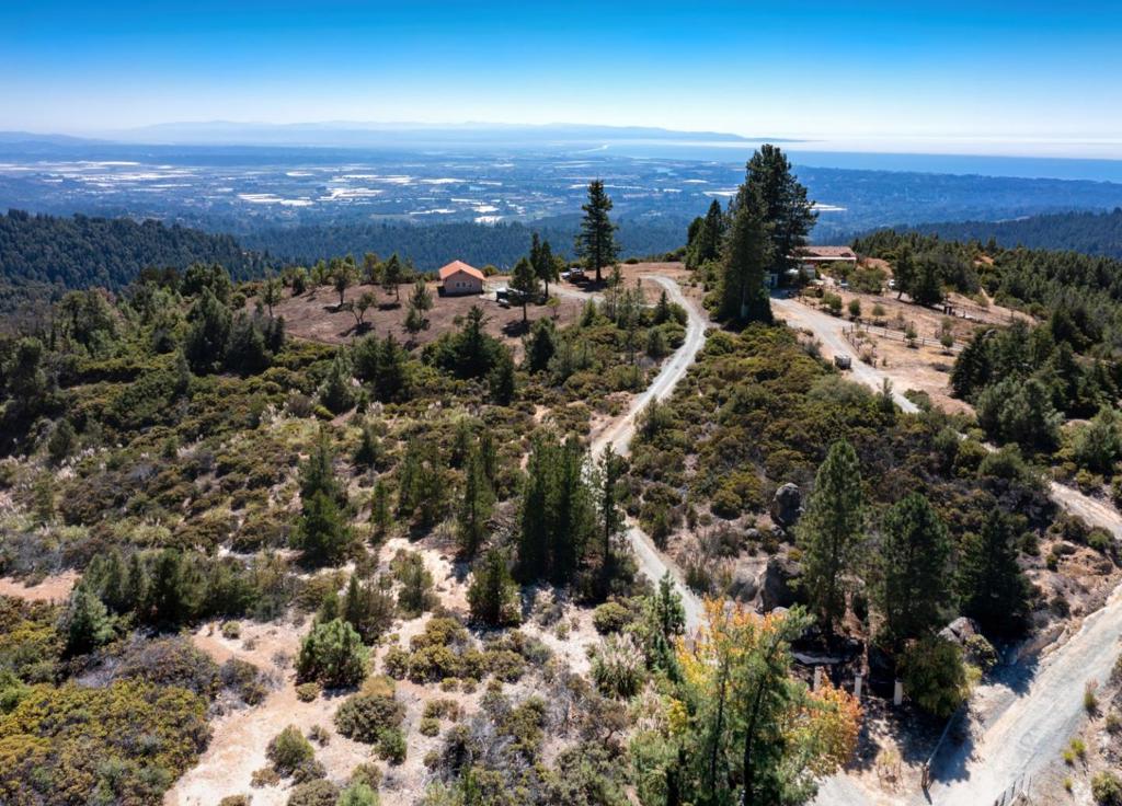 Spectacular Gated Estate property, 20+ Acres, Massive Ocean Views From Hollister to Monterey to Santa Cruz, Lots of usable land, interesting rocks to hike around, seasonal pond, end of road location,neighborhood enjoys underground power. Lots of infrastructure in, Well and septic on record. Existing Garage and pumphouse, electrical ungrounded to site. Original Home was destroyed in House fire, never rebuilt. This is a perfect blank slate for your dream estate property above it all! Must see!
