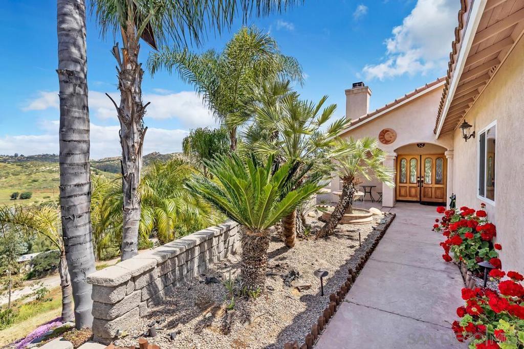 Unmatched Views & Single-Story Living in Ramona Perched on 1.25 acres with sweeping mountain views, this beautiful single-story home offers the perfect blend of space, comfort, and serenity. With 3 bedrooms, 3 bathrooms, and 1,911 sq ft of well-designed living space, you’ll find room to relax, entertain, and truly enjoy the peaceful lifestyle Ramona is known for. Step into a welcoming living room with a cozy fireplace—perfect for cool evenings or creating that perfect ambiance. The spacious kitchen offers ample cabinetry and storage, ideal for everything from everyday meals to weekend gatherings. Outside, the large back deck is your front-row seat to panoramic mountain views—whether you're sipping morning coffee, unwinding at sunset, or hosting friends for a BBQ. With PAID SOLAR, an EV charger, and a whole-house water filtration system, this home is as efficient as it is inviting. Located just minutes from town, you'll enjoy the quiet of the countryside without sacrificing convenience. Don’t miss your chance to own this view-filled retreat in the heart of Ramona!