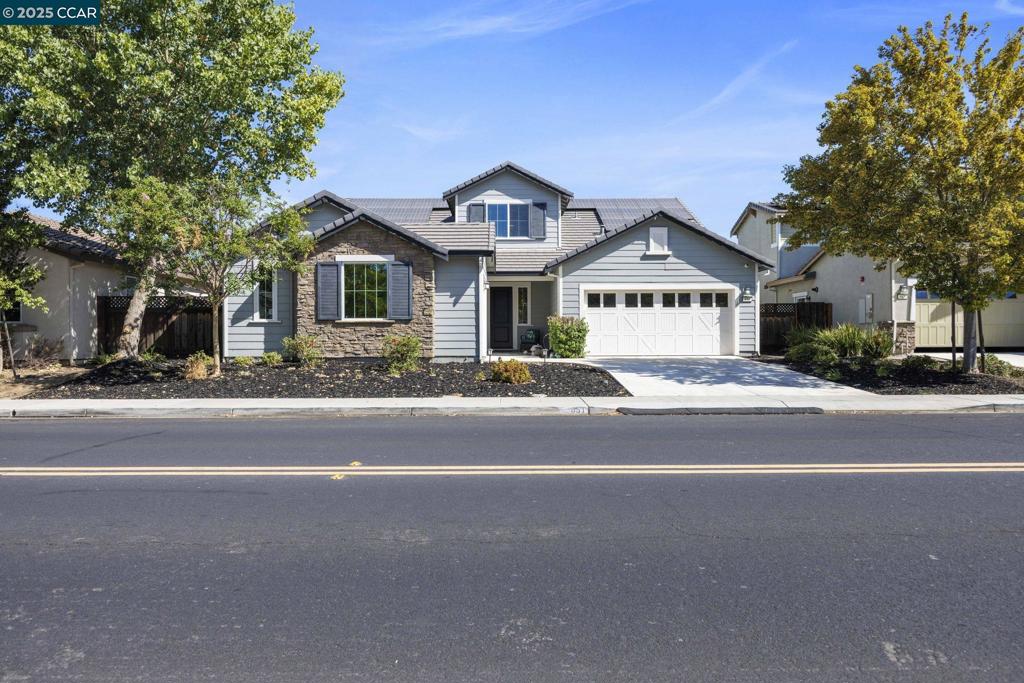 This expansive open concept two-story residence offers a perfect blend of luxury and functionality. With two primary bedrooms on the first level, one of which serves as a charming Jr. Suite/Casita with its own separate entry. This layout is ideal for multi-generations living, hosting guests/in-laws, or potential income-producing rental. The heart of the home features a spacious living area that seamlessly connects to a modern kitchen, making it perfect for entertaining. Upstairs, you'll find a generous loft that serves as an additional living or play area, along with large bedrooms providing ample space for family and friends. This property is equipped with solar panels, including an EV charging station, ensuring both efficiency and sustainability. Step outside to your private oasis, where lush pomegranate and fruit trees create a vibrant backdrop for relaxation and outdoor gatherings. Situated in a desirable Brentwood neighborhood & minutes away from downtown, this home is perfect for those seeking a versatile living arrangement. Welcome home!