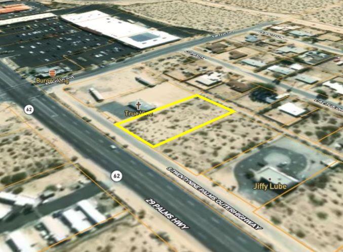 Large 1/2+ acre zoned commercial with Hwy visibility on an outer hwy road for easy customer access. Located in the trendy Smoke Tree neighborhood of 29 Palms. Set adjacent to one of the main malls in the city. Pavement, power, and water appear to be available, also alley access. The City may allow for retail, restaurant, drive through, tourist services, church, or more. Set about a half mile from the base of the 49 Palms Canyon. The Smoke Tree neighborhood is known for its awe inspiring views of Little San Bernardino Mtns. 29 Palms is enjoying new restaurants, new shops, new retail buildings, new hotels, the new Freedom Mall, and expanding economic growth. About 3 million tourists visit the Joshua Tree National Monument annually. Hot vacation area. The Tortoise Rock casino, the 29 Palms Inn and Oasis, and the Marine Base are some well established anchors of the community. Mild winters have some people calling 29 Palms a Little Palm Springs. In recent years more celebrities, architects, designers, musicians, and artists have discovered the beauty and peaceful ambiance of the area. Priced to sell. Buyers must contact the city for all questions on building and uses. Buyers must contact the utilities agencies for all questions on utilities. APN: 0615-041-09-0000 Address is a real address. Don't Wait - Call Now!