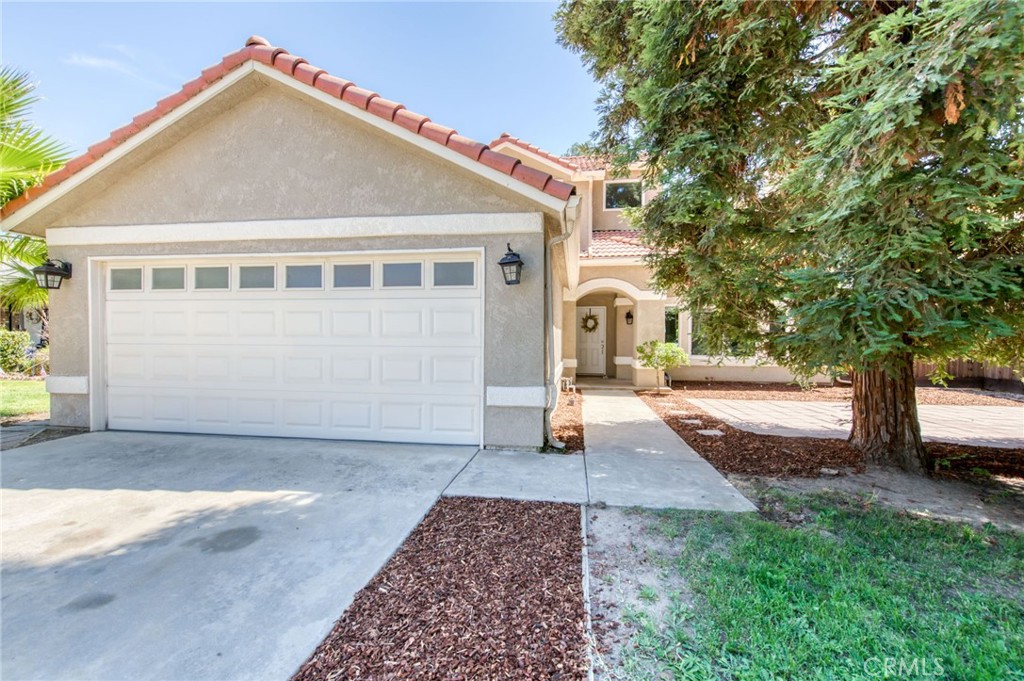 Ideally situated in Northeast Fresno, step inside to discover a fresh, 3 bedroom, 3 bathroom, modern interior. Offering new vinyl plank flooring throughout, updated bathrooms with water-saving fixtures, and stylish new lighting. The airy great room invites you in with vaulted ceilings, abundant natural light, and a cozy fireplace seamlessly connecting to the dining area, perfect for entertaining or everyday living. A bonus washer, dryer, and refrigerator are included for added value and move-in ease.
The kitchen overlooks the lush backyard and sunlight, offering a bright and cheerful space to cook and gather. Ideal for extended family or visiting guests, the downstairs features a private bedroom and full bathroom. Upstairs, the secondary bedroom includes its own ensuite, while the spacious owner's suite is a true retreat with a walk-in closet, spa-like bathroom, and private balcony overlooking the peaceful yard.
Step outside to your entertainer's paradise, complete with mature landscaping, an expansive patio, and a fenced dog run for your four-legged friends.
Nestled in a quiet pocket just behind the Via Montana Shopping Centre, you'll enjoy unmatched convenience just minutes from top-rated schools, upscale dining, premier shopping, Woodward Park, and exclusive country clubs.
Move-in ready and located in one of Fresno's most desirable areas! Call today to schedule your private showing.