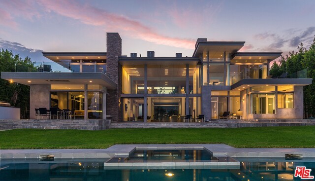 A Contemporary Architectural Masterpiece in the highly sought after Rivera neighborhood of Pacific Palisades. This meticulously designed six bedroom, seven bathroom private retreat features soaring ceilings, open beams, large windows and sliding glass doors which provide an abundance of natural light and seamless transition between indoor and outdoor living spaces. Designed for entertaining, the chef's kitchen opens into the family room and breakfast area. The luxurious master suite leads out to a private patio with endless views. The two story living room with fireplace opens to a private terrace with an infinity-edge pool and breathtaking views of the Riviera Country Club.