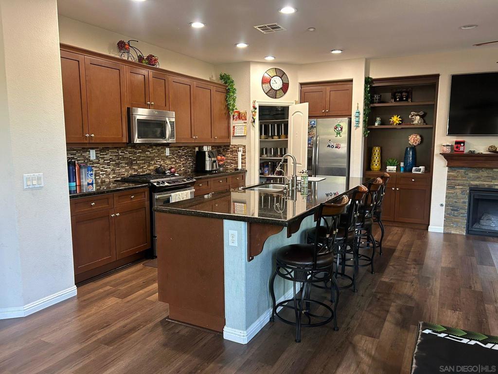 Great location in San Marcos. Highly upgraded end unit in Laurel Community of Old Creek Ranch with community pool. New paint, New flooring. Ideally located inside the complex with a delightful patio. Master suite with 2 walk-in closets. Kitchen is a chef's delight with granite counters, SS appliances and lots of cabinets. Electric car charger in the garage. Close to San Elijo Hills. beaches and shopping. A sought after community waiting for you