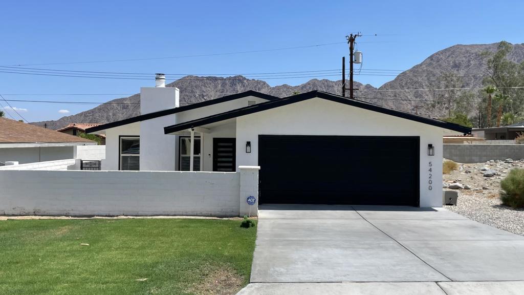 Welcome to this beautifully updated single-story home that blends comfort and space. This is a beautiful stunning modern home with surrounding views of the Santa Rosa Mountains. This home is conveniently located in La Quinta Cove just one block from mountain hiking/biking trails, the historic Old Town La Quinta, the famous La Quinta Resort & Spa, tennis, golf, restaurants, This stylish single family home offers 1,361 sq.ft. of family living, 5227 sq. ft. lot, there are three bedroom and two remodeled bathrooms, newly installed porcelain floors, newer windows, ceiling fans, recessed lighting, tile work, newer backyard turf and a covered side patio. The fully equipped kitchen with quartz countertops and stainless steel appliances is perfect for family time and entertaining. There is a large family room with a fireplace with lots of natural lighting plus a two car garage with direct access to the house. This bright and charming home offers everything you need, This is a must see !!