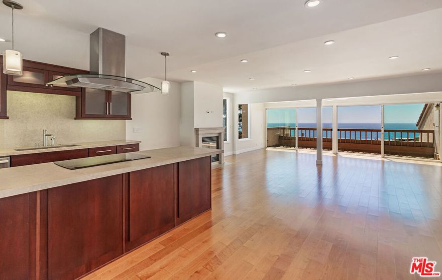 Experience elevated coastal living in one of the most distinguished residences within the coveted Maison De Ville complex. This rare corner penthouse showcases sweeping, unobstructed ocean views and captures both breathtaking sunrises and moonrises offering a visual spectacle from dawn to dusk. Thoughtfully and tastefully remodeled, the home exudes sophistication and quality craftsmanship throughout. Rich maple and travertine flooring flow seamlessly through the space, while the gourmet kitchen features custom cherry wood cabinetry, brushed nickel hardware, premium stone countertops, and top-of-the-line stainless steel appliances perfect for both daily living and entertaining. The powder room and both upstairs baths have been fully renovated with high-end designer finishes and luxury fixtures, creating spa-like retreats within your own home. Ideally situated just minutes from world-class beaches, popular shops and restaurants, and the prestigious Pepperdine University, this home offers both convenience and coastal elegance. This is a truly exceptional offering combining style, comfort and value in an unbeatable Malibu location. Don't miss the opportunity to make this remarkable penthouse yours.