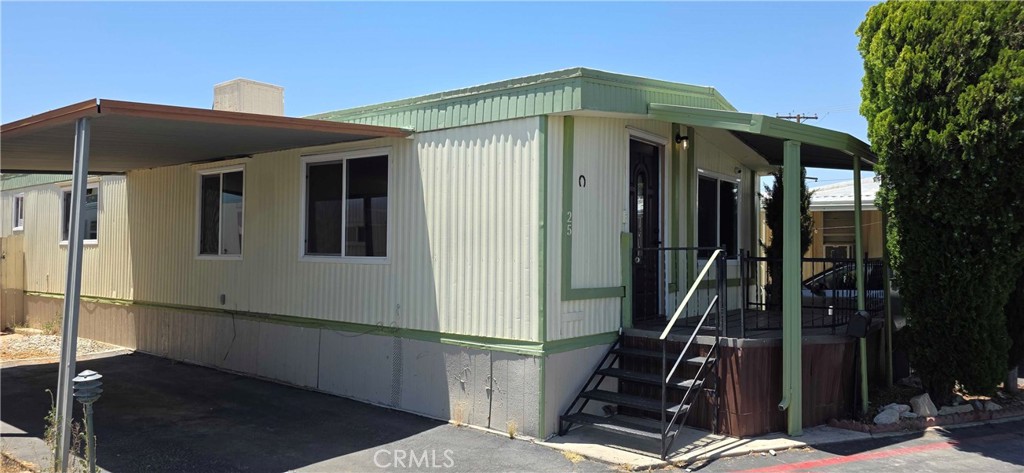 Welcome to Desert Trailer Life, a family-friendly community in Victorville! This charming double-wide, three-bedroom, two-bath home is priced under $100,000—a fantastic opportunity you don’t want to miss. The spacious floor plan includes indoor laundry hookups, built-in cabinetry, and durable tile and laminate flooring throughout—no carpet to maintain! The lower kitchen cabinets are all new, and also the new stove. Bonus: windows were updated/replaced at some point in the past. Enjoy covered parking and community amenities including a swimming pool, self car wash, and coin-operated laundry facilities. Ideally located just minutes from Costco, the Victor Valley Mall, grocery stores, restaurants, downtown Victorville, Plus convenient, close-by freeway access.