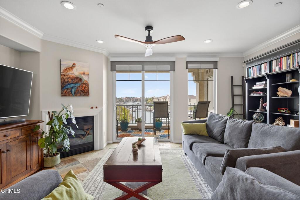 Enjoy unobstructed views of the Channel Islands Harbor from nearly every room. Perfectly capturing the essence of coastal living. The most desirable southern exposure floods the interior with natural light. Features include kitchen with a center island high-top bar, granite countertops, stainless steel appliances, and elegant slate flooring through the main living areas The living room boasts a cozy fireplace, large slider with breathtaking views. Both bedrooms include en suite bathrooms, master walk-in closets, and mirrored wardrobes. All with scenic water vistas. Condo is located on the first floor with a single-level layout.Community Amenities: Residents have access to gated subterranean parking with a storage area and two designated side-by-side spaces, a beautiful spa, and a lush landscaped courtyard with seating and fountain areas.Schedule your viewing today!