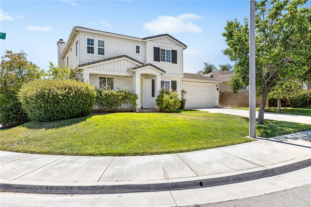 Located in the highly sought-after Heritage Lake community, this beautifully maintained 4-bedroom, 2.5-bathroom home offers over 2,400 square feet of spacious living on a desirable corner lot in Menifee. From the moment you arrive, you'll appreciate the curb appeal, expansive front yard, and the natural light that pours into every room. The flexible floor plan features multiple living areas and a generous kitchen perfect for hosting family and friends. All bedrooms are upstairs, including a spacious primary suite with dual sinks, a soaking tub, and a walk-in closet. Step into the backyard to find freshly laid sod and a covered alumawood patio, ready to be transformed into your own private outdoor retreat. Whether it's summer barbecues or quiet evenings under the stars, this space is made for enjoying Southern California living. Heritage Lake offers residents access to scenic walking trails, parks, a clubhouse, and a private lake. With shopping, schools, and freeway access just minutes away, this home offers the perfect blend of community, comfort, and convenience.