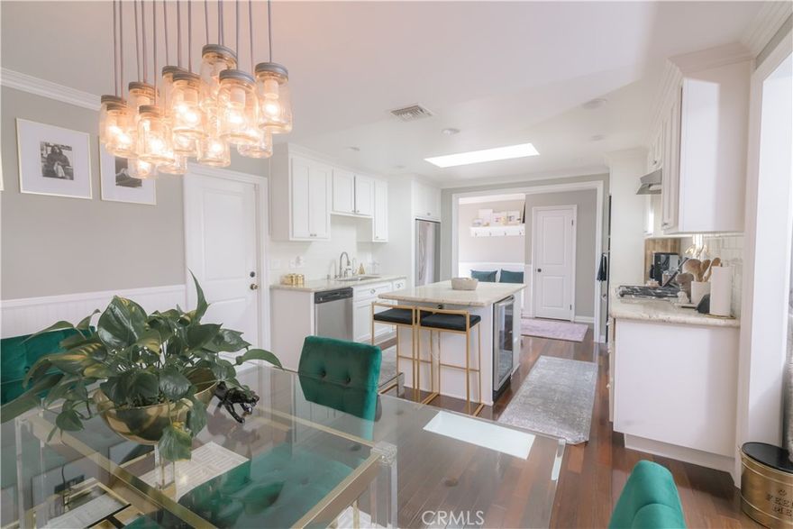 Updated single-level pool home with a private manicured backyard.  This three-bedroom two, two-bathroom home is warm, inviting, and filled with designed touches. Natural hardwood floors flow throughout the house.  Beautiful double French doors open onto the entertainers' backyard with a pool and built-in BBQ with bar seating.  Upgraded kitchen with granite counters, gas range, refrigerator, and wine refrigerator. Ceiling fans in each bedroom.  The garage has been updated with epoxy flooring and new storage cabinets and can be used as additional office space.  The cozy living room is complete with a wood-burning fireplace.  The back gate opens onto a tree-lined park with walking trails and a playground. The owner pays for pool and gardening services.