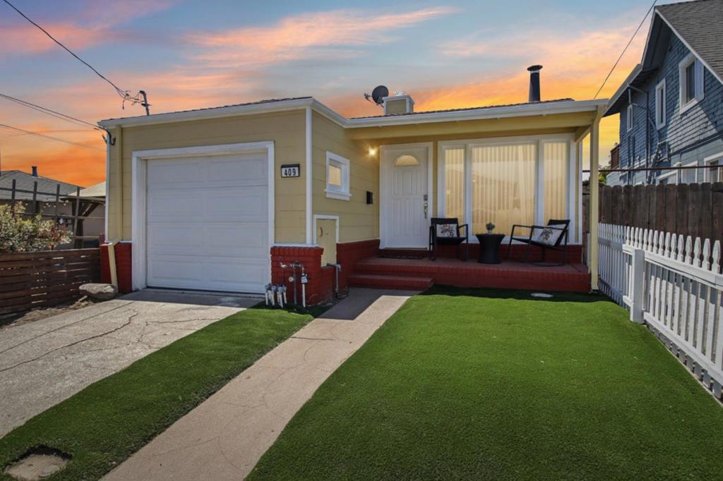 Welcome to the little yellow gem! Located just minutes from San Bruno Park and Grundy Park, this home offers the perfect blend of comfort, convenience, and community. A welcoming front porch sets the toneperfect for enjoying your morning coffee or tea. Inside, the cozy living room features a fireplace, creating a warm and inviting space to relax. The kitchen is complete with granite countertops and a sunny breakfast nook, ideal for casual meals or catching up with friends. Hardwood floors run throughout the home, which includes two generously sized bedrooms and a spacious hall closet for all your storage needs. Step out from the back room onto the deck and enjoy a good-sized backyardperfect for weekend gatherings, BBQs, or quiet outdoor moments. The one-car garage offers additional storage, great for holiday décor or your favorite hobbies. With easy access to parks, local schools, shops, and commute routes, 409 Chestnut Ave is a lovely place to call home.