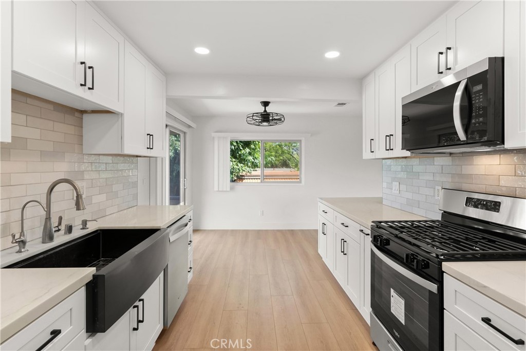 This completely remodeled 2 bedroom, 1 bath unit offers modern comfort and style in a quiet, well-maintained community. Enjoy a spacious living area that opens to a private balcony, perfect for relaxing or entertaining. The unit features brand-new flooring, an upgraded kitchen with new stainless steel appliances, and a brand-new HVAC system for year-round comfort. Additional amenities include an assigned garage space, additional available parking, and convenient on-site laundry facilities. Located in a peaceful residential neighborhood, this property provides easy access to top local attractions including the new Yorba Linda Town Center, Main Street Historic District, Black Gold Golf Club, the Nixon Library & Museum, as well as the popular Brea Mall and Downtown Brea. Don't miss this opportunity to live in a beautifully updated unit in one of Yorba Linda’s most desirable areas!