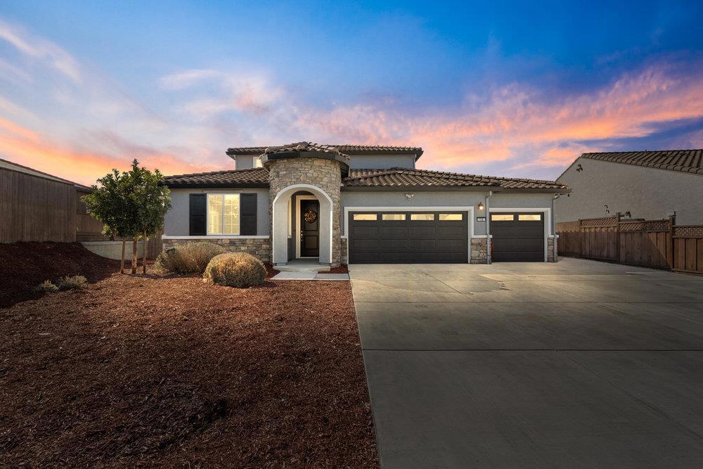 Luxury living in this CUSTOM Ladd Ranch II single story. You asked for UPGRADES? Here you go! 4-5 bed/2.5 bath 2,766 sq ft. 2021 build - HUGE lot. Step inside & youll find a bright & inviting layout that makes daily living easy, with plenty of room to relax or entertain. TRUE 3 door 3 car garage - no tandem parking. Solar is completely owned. No HOA fees. This is the Audrey floorplan & was designed to accommodate another bedroom & full bathroom downstairs (currently used as a flex space/den/hobby room). The remaining 3 bedrooms, full bath w/ double vanity & a large loft upstairs. LARGE Laundry room downstairs. Primary bedroom SUITE downstairs. Extra wide driveway w/ concrete down each side of the house & an OVERSIZED covered patio in the back. Windows professionally tinted. LVP/Tile/High End Mohawk Carpet. New interior/exterior paint. Added LED lights in den/garage. The whole house & backyard patio are pre-wired for ceiling fans. Upgraded blinds throughout home. EXPANSIVE sliding glass door system from kitchen/family room area to backyard PLUS gorgeous windows & natural light all over. Extra fencing added on driveway side & backyard side. Garage is a DREAM - tape/texture/paint & epoxy floor, extra lighting & ceiling fans + Heat/AC split plumbed. EV charger pre-wired.