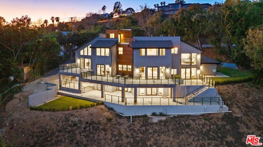 New construction and ocean views from this amazing multi-level contemporary home in Malibu, California. Where luxury and modernity meet against the stunning backdrop of the Pacific Ocean and majestic mountains. This newly constructed masterpiece spans an impressive 5,120 square feet on a sprawling one-acre plot, offering unparalleled privacy with fenced and gated security. As you step inside, you'll be greeted by the timeless elegance of engineered European white oak hardwood flooring, seamlessly extending throughout the house, complemented by sleek tile accents in the bathrooms and laundry areas. The heart of this home lies in its open kitchen, adorned with Quartz countertops and equipped with top-of-the-line Subzero French door refrigerator, wine column fridge, Wolf 6-burner stove, built-in microwave, and Cove dishwasher appliances, ensuring both style and functionality for the culinary enthusiast. Natural light floods the interiors through dual pane windows by Milgard and La Cantina dual pane French doors, framing breathtaking views of the ocean and mountains from every angle. The home's lower level is a 1,463 square foot daylit basement with a kitchenette, living area, 2 bedrooms, 2 full en suite bathrooms, and storage space.  This area could be used as a separate living space. Entertaining is a breeze with three levels of outdoor space, including a spectacular ocean and mountain view roof deck. Retreat to the comfort of 5 spacious bedrooms, each boasting ensuite bathrooms for ultimate convenience and privacy. Cozy up by one of the two gas fireplaces, adding warmth and ambiance to cool Malibu evenings. With parking for up to 10 cars, including a 2-car garage, accommodating guests is effortless. Enjoy the convenience of a tankless water heater and central heat and air conditioning, ensuring comfort and efficiency year-round. In this Malibu oasis, you will find every detail has been meticulously crafted to offer a lifestyle of luxury, comfort, and serenity amidst the beauty of Southern California's coastline.
