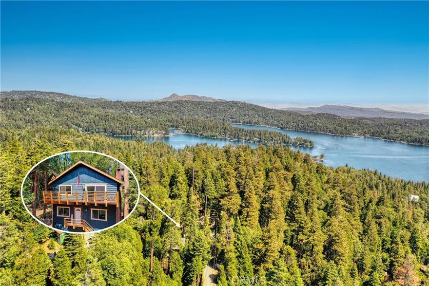 Nestled in the serene beauty of Lake Arrowhead, this enchanting 2 bedroom, 2 bath upgraded home invites you to unwind, reconnect, and savor the best of alpine living. Just minutes from the heart of Lake Arrowhead Village and the whimsical charm of Sky Park at Santa’s Village, this home blends mountain elegance with everyday comfort. Step inside to find a light-filled interior with rustic wood beam ceilings, an open-concept living area, and a stone-framed fireplace that sets the tone for cozy nights in. The fully appointed kitchen features modern appliances, updated cabinetry, and a breakfast bar perfect for morning coffee or evening wine. Both bedrooms offer peaceful forest views and thoughtful design, while the beautifully updated bathrooms boasts a soaking tub and shower with artisan tile work, creating a luxury experience. Outdoors offers a spacious forest view deck opening up to treetop vistas and breathtaking sunsets ideal for entertaining, grilling, or simply soaking in mother nature. Towering pines surround the property, offering privacy and a sense of seclusion, while still being close to shops, dining, and year round recreation. Whether you’re hosting friends around the fireplace, sipping cider beneath the stars, or enjoying morning hikes by the lake, this home is the perfect escape crafted for those who crave nature, comfort, and connection.