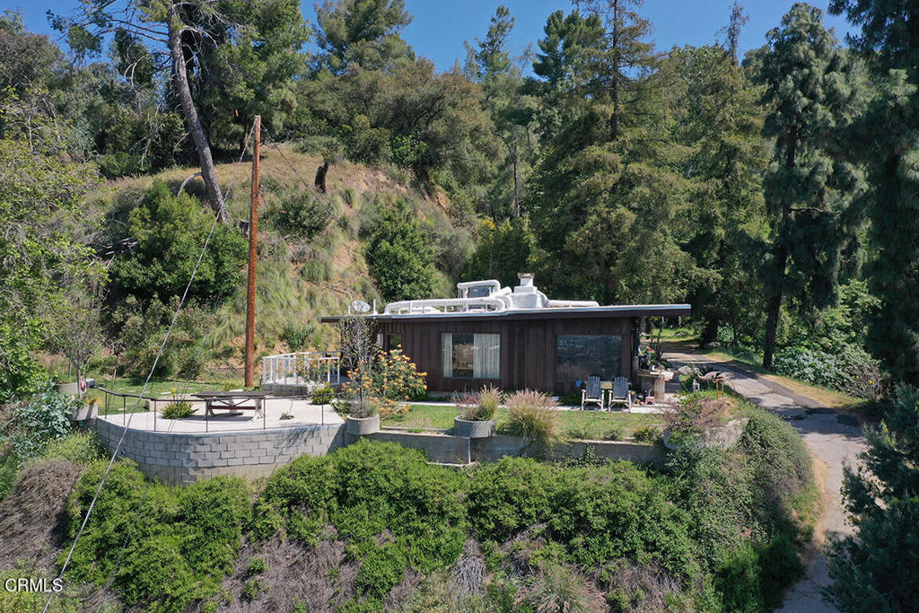 One of the best views in Monrovia. Over 4.5 acres with a flat pad, lawn entertainment area, lots of hillside and a giant bamboo canyon. This 3 bedroom 2 bath home is cozy, full of character, warmth and extremely private. A must see for anyone wanting to live in a wildlife area.