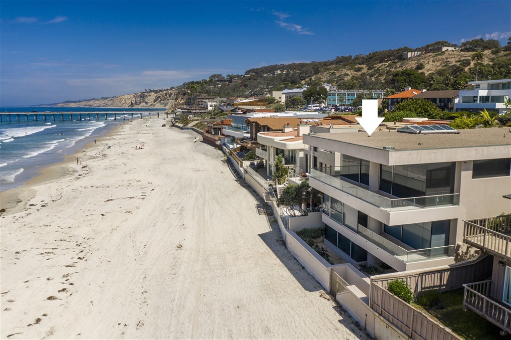 Beachfront and prominently positioned for maximized panoramic coastal views and privacy, this voluminous gated home includes 50' of footage on La Jolla Shores Beach, one of only 22 homes on this renowned and coveted stretch of California waterfront. Massive collapsible walls of glass and an expansive viewing deck embrace endless whitewater surf, sunset, wildlife, and people-watching. Pls see Supp. With an elevator serving each level and carefully landscaped grounds, maintenance is kept to a minimum so pure pleasure can be celebrated. A grand, exceptionally large master suite encompasses an entire floor, with luxury his & hers bathrooms, fireplace, spa tubs, spacious, and overly spacious separate closets. Enjoy two additional bedroom suites and an office/optional 4th bedroom. The chefs' kitchen offers slab granite counter-tops, dual dishwashers, separate prep sink, double refrigeration, center island, and double ovens. An expansive recreation/game room with full bath, two fireplaces, complete kitchen and bar with birdseye maple cabinetry, sink, dishwasher, wine cooler, and counter-tops servicing game area. A separate laundry room includes a pet shower, laundry chute from master closet, and extensive storage opening to private patio. A private gate leads to the sand from this sleek contemporary structure of over 9,000sf. Equipment: Range/Oven Other Fees: 0 Sewer: Sewer Connected Topography: LL Frontage: Ocean/Sand