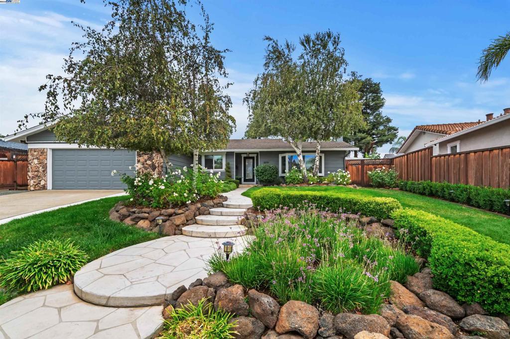 Pride of ownership shows in this sought after 3 bedroom, 2bath home in Livermore's desirable Shadowbrook neighborhood. Freshly painted on the exterior and 90 percent of the interior, new manufactured wood floors the Family/living room offers fireplace with surround custom cabinetry with leaded glass doors and shelves for personal display items. The kitchen offers an open floor plan to host a large table, island with barstool seating, custom bar/coffee station area, a sliding glass door to an "Oasis" of a backyard with multiple sitting areas, in ground pool, outdoor kitchen area, covered gazebo area, endless entertaining opportunities, new sod, side yard for possible bocce court, she/he/kids sheds, garden area-whatever your vision may be and an in ground pool. The 10,308 square foot lot makes this location one can do many things with longterm. Livermore Valley schools are nearby, plenty of shopping, eateries, Downtown Livermore, Livermore Wine Country, ACE train, Sycamore Grove Park and Alden Lane Nursery are all easy access from the Shadowbrook Neighborhood.