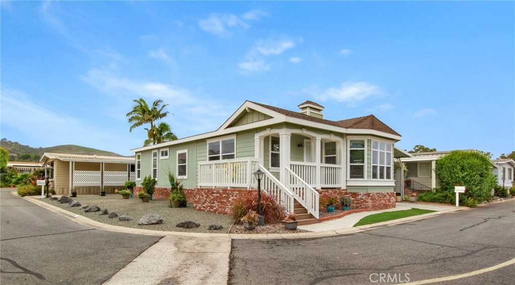Welcome home to this stunning 3 bedroom, 2 bath Manufactured home in the 55+ Community of Rancho Alipaz! This home is uniquely situated on a large corner lot full of potential to add to the beautiful drought resistant landscaping and offers beautiful mountain views from the spacious covered porch. This well taken care of craftsman-style home offers an open-concept living room, kitchen and dining. The living room has 9-foot ceilings and a nice expansive feel. The kitchen features an oversized granite island with matching counter tops, modern stainless-steel appliances and a separate walk-in pantry. Enjoy your option to convert the third bedroom into a home office, or leave it as a bedroom. The spacious Primary Suite also offers vaulted ceilings with a skylight for ample natural light, a generous walk-in closet and En Suite Bathroom with a walk-in shower and dual shower heads. The home creatively allows plenty of storage space. The driveway leads to a double carport with an enclosed workshop/shed, and from the driveway is the convenience of an additional entrance to the home where the interior laundry room leads to kitchen. The park includes organized activities so that residents can get to know each other, a pool, spa, exercise room and putting green! Alipaz Street is just up the way from downtown Dana Point and the Harbor, and just down the way from Historic and buzzing Los Rios district. Walk to the charming and iconic train station in Downtown San Juan or ride your bike to the Pacific Coast Highway. There is an onsite Park office and optional RV parking.