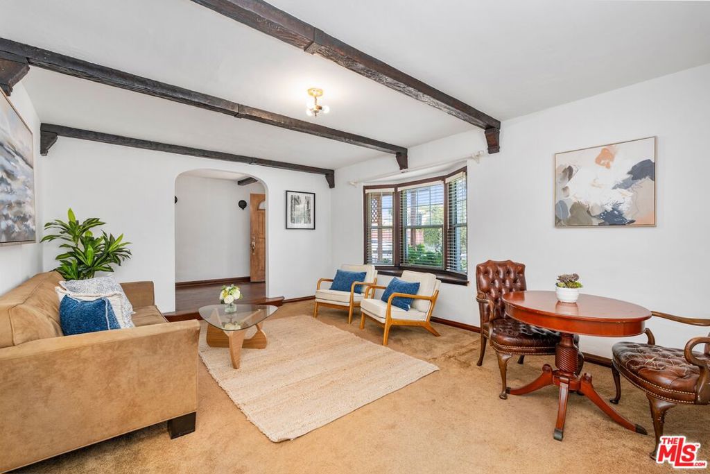 Charming single-level Spanish-style home located approximately one mile from the beach and 1/2 mile from the bike bath in Marina del Rey. This 3 bedroom 1 bath residence sits on a picturesque street and features a welcoming foyer with hardwood floors and vintage character throughout. Filled with natural light, the home boasts a spacious living room, a large skylight over the dining area, open kitchen offers warm wooden cabinetry, tile countertops and tile flooring. Enjoy a private grassy backyard with a mature lemon tree and plenty of space for for outdoor dining and lounging. A detached oversized garage with a 3/4 bath offers excellent potential for ADU, guest suite, or creative studio. A rare opportunity to update and make this special home your own.
