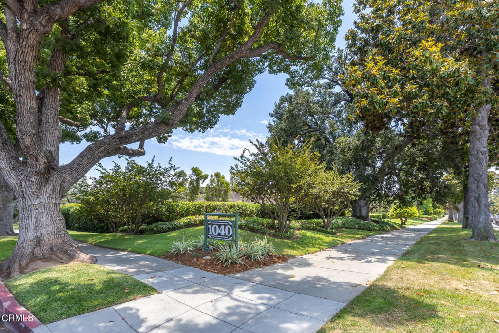 Welcome to this beautifully updated condo that lives and feels like a single-family home, perfectly situated on Pasadena's prestigious South Orange Grove Boulevard, known as Millionaire's Row. This contemporary three-bedroom, three-bath residence offers the ease of single-level living in one of the city's most coveted neighborhoods.Inside, the spacious living room features soaring vaulted ceilings, exposed beams, custom built-ins, and a dramatic fireplace, creating a warm and inviting atmosphere. The living room, formal dining area, and primary suite all open to a tranquil private atrium, bringing in abundant natural light and blending indoor and outdoor living. A generously sized front patio also offers the perfect space for entertaining or relaxing outdoors. The modern kitchen is outfitted with white cabinetry, stone countertops, a mosaic tile backsplash, and stainless steel appliances, combining functionality with style.Nestled within a well-maintained complex surrounded by lush, mature landscaping, the property offers access to a community pool and includes a private two-car garage with ample room for parking and storage. As an added bonus, enjoy front-row access to the iconic Pasadena Rose Parade, just steps from your front door. Minutes away from freeway access, Huntington Hospital, Old Town Pasadena, Arlington Gardens, and more.