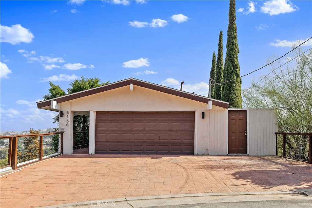 Views, Views, Views! Nestled in a fabulous South of the Boulevard Woodland Hills neighborhood, this stunning home sits on a private and spacious 17,000 sq. ft. lot. Featuring 3 bedrooms and 3 bathrooms, this light-filled residence welcomes you with an open-concept main level showcasing floor-to-ceiling windows that capture breathtaking views and flood the living, dining, and kitchen areas with natural light. Enjoy direct access to the garage for added convenience. Downstairs, you’ll find all bedrooms along with a bonus living or game room with a cozy fireplace, ideal for relaxation or entertaining. The lower level, which can be included in the lease, features its own kitchenette and bathroom, making it perfect for guests, extended family, or a private home office. As you make your way to the impressive outdoor deck, prepare to be captivated by sweeping views of the valley and surrounding mountains, offering a true sense of peace and tranquility. Located just minutes from major freeways, Warner Center, fine dining, premier shopping, and top-rated schools, this home truly embodies the best of California living.