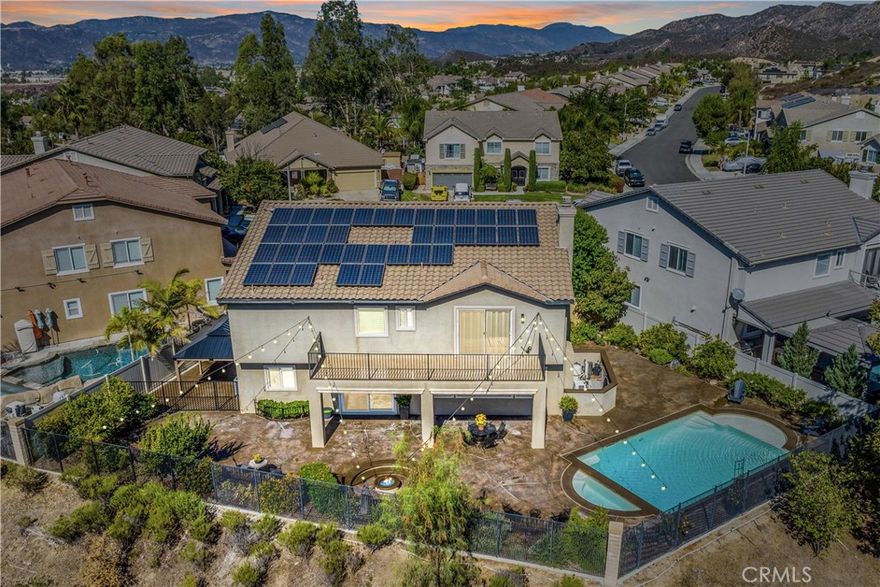 Incredible opportunity to own this executive home with all the features buyers request most.  Panoramic views, pool, main floor bedroom, quiet cul de sac location for privacy, No HOA dues, solar and low, low tax rate keep this home affordable!  Enter through a covered front porch to the formal living room to see that the whole home has new hard wood flooring, new light fixtures, plantation shutters and more.  Pass through the formal dining room to the spacious great room at the rear of the home which features a family room space with fireplace, eating area and impressive kitchen with granite counters, stainless appliance package, pantry, center island and absolutely loaded with cabinet and counter space.  All of this looking out to the heated saltwater pool, spa, firepit and 180 degree views of all of Temecula, the hills and city lights.  Main floor bedroom with its own bath and large laundry/mud room complete the main floor.  Second floor features a massive loft/family room, 3 large guest bedrooms and an amazing primary suite with it's own private retreat/bonus room, luxury 5 piece bath, walk-in closet and private balcony/deck to take in the breathtaking views.  New A/C and solar keep it cozy and comfortable. Outside, sculpted concrete patio, sunken fire pit, pool, covered dog run, and fruit trees all on a lot that you just can't find anywhere else.  Home water softener filtration system, new perimeter fencing, removable locking security pool gate and so much more. Close to parks, top rated schools, shopping, award winning wineries, and with easy freeway access for commuters.  Homes with all these features are hard to find, and even harder to forget, if you let it pass you by!