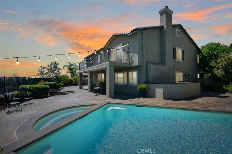 Stunning Panoramic views, views, views!  Sparkling heated pool, main floor bedroom, quiet cul de sac location for privacy, No HOA dues, solar and low, low tax rate keep this home affordable!  This highly upgraded executive home has all the features buyers request most.  Enter through a covered front porch to the formal living room to see that the whole home has new hard wood flooring, new light fixtures, plantation shutters and more.  Pass through the formal dining room to the spacious great room at the rear of the home which features a family room space with fireplace, eating area and impressive kitchen with granite counters, stainless appliance package, pantry, center island and absolutely loaded with cabinet and counter space.  All of this looking out to the heated saltwater pool, spa, firepit and 180 degree views of all of Temecula, the hills and city lights.  Main floor bedroom with its own bath and large laundry/mud room complete the main floor.  Second floor features a massive loft/family room, 3 large guest bedrooms and an amazing primary suite with it's own private retreat/bonus room, luxury 5 piece bath, walk-in closet and private balcony/deck to take in the breathtaking views.  New A/C and solar keep it cozy and comfortable. Outside, sculpted concrete patio, sunken fire pit, pool, covered dog run, and fruit trees all on a lot that you just can't find anywhere else.  Home water softener filtration system, new perimeter fencing, removable locking security pool gate and so much more. Close to parks, top rated schools, shopping, award winning wineries, and with easy freeway access for commuters.  Homes with all these features are hard to find, and even harder to forget, if you let it pass you by!