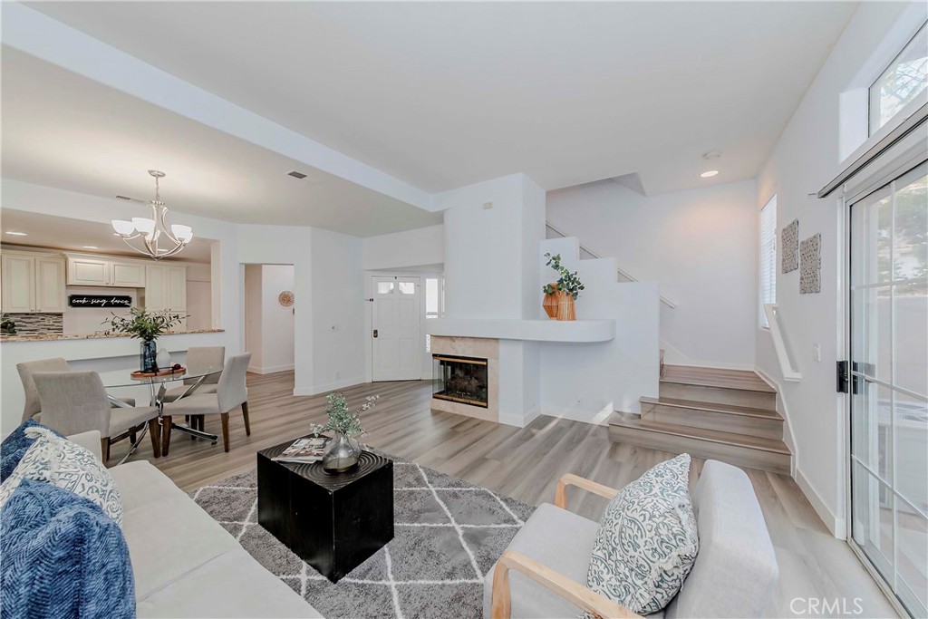 Nestled in the highly sought-after community of Maison De Fleur in Fullerton, this desirable home offers comfort, convenience and charm. Step inside to discover a spacious open floor plan featuring 3 bedrooms and 2.5 bathrooms. The welcoming living room boasts brand new flooring and a cozy fireplace, perfect for relaxing or entertaining guests. The upgraded kitchen includes elegant cabinetry and granite countertops along with a cozy breakfast nook where you can enjoy your morning coffee. Abundant windows for a bright, airy ambiance while skylights bring in plenty of natural light, creating a warm and inviting atmosphere. The master suite includes a walk-in closet as well as a mirrored closet. Down the hall, you will find two additional bedrooms, a full bathroom, and a convenient upstairs laundry chute. Enjoy direct access to a two car garage and spacious back yard. Take advantage of the community's HOA amenities, including a sparkling pool, relaxing spa and children's playgrounds. This home is centrally located near a variety of shopping destinations such as Lowe's, Costco, Walmart, Sam's club and more with a wide selection of restaurants just minutes away. You'll also be within walking distance of Ralph B. Clark Regional Park and Westridge Golf Course offering the perfect balance of nature and neighborhood living.