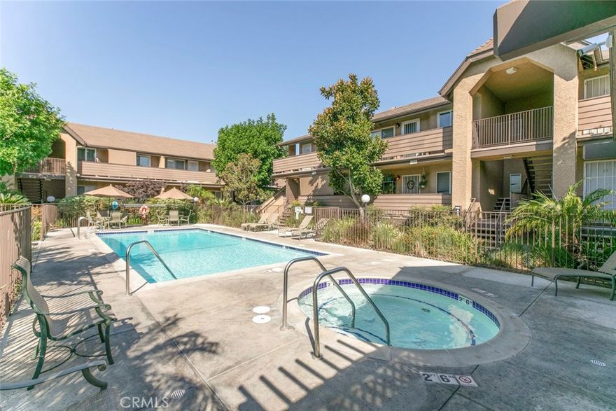 Location, location.  Fully upgraded 2 bedrooms and 1.5 bathrooms condominium 837 sq. ft. Corian Counter tops, recessed lighting, no carpet, mirrored sliding closet doors.  Refrigerator, stove, oven, dishwasher, Private Laundry room underneath the unit, includes Washer and Dryer,  Parking and Laundry Room under unit.  Gated community with main entrance on Sherman Way and second entrance on Kester.  Small gate in front of the unit. excellent location East of 405 freeway. Landscaped grounds, 2 pool areas.  Spa, Guest Parking.
