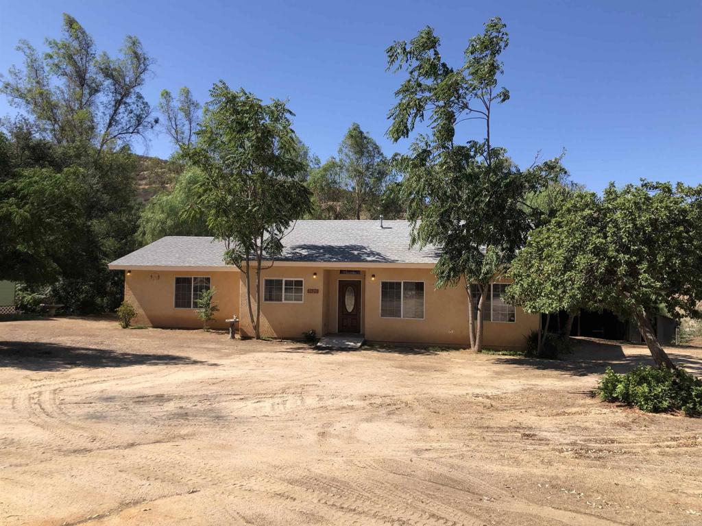 Located in Northeastern Jamul. Newley refurbished and beautifully done. A rare find in price and value in this area. This is a move in ready fresh clean home. Modern kitchen and living design with vaulted ceilings, recessed lighting, arched doorways. This is a 3 bedroom with 3 full baths with an additional den! Lots of space. Plenty of room (5 acres) for animals, toys, motorhome parking etc. Family friendly interior home design. Big area to construct a future ADU or workshop?
