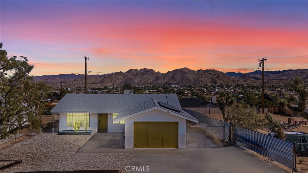 This 3 Bedroom, 1 Bath turn-key haven is ready for you—FULLY FURNISHED and styled to perfection. With Solar this home is both eco-friendly and cost-efficient. Just steps from downtown Joshua Tree and only minutes from the National Park entrance, this bright and inviting retreat offers both convenience and desert charm.
Enjoy peaceful surroundings, gorgeous mountain views, and a true move-in ready experience—no remodeling, no furnishing, no stress. Just bring your toothbrush and step right into the Joshua Tree lifestyle.
The outdoor spaces are just as special—multiple seating and dining areas, a custom mural patio, firepit for late-night conversations, and a relaxing hot tub perfect for stargazing under the desert sky.
With solar in place, style, and location—this isn’t just a home, it’s a destination. Don’t wait—schedule your showing today!